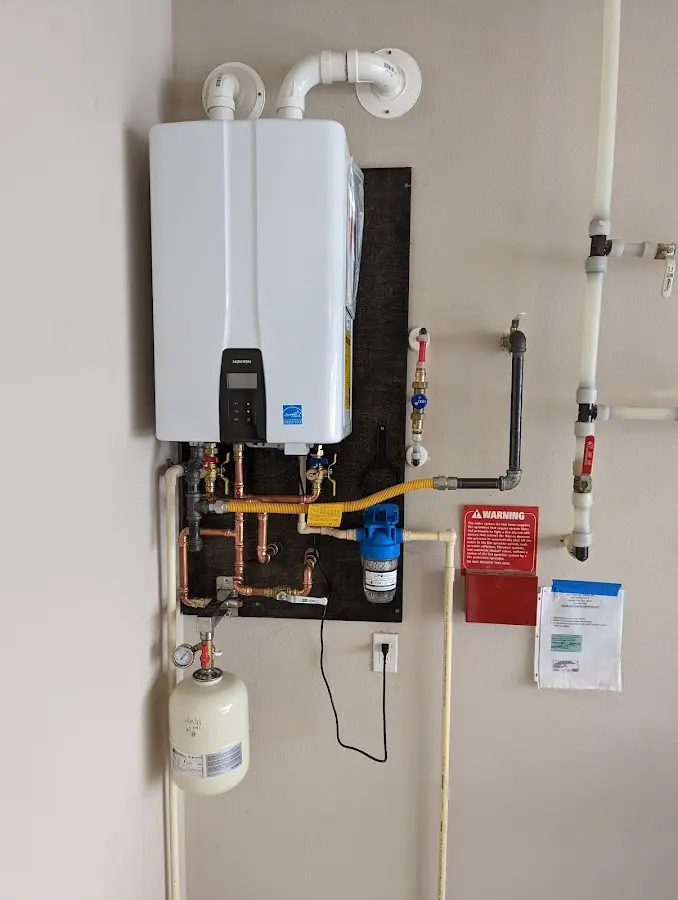 Professional plumber installing copper piping in a Gaines home